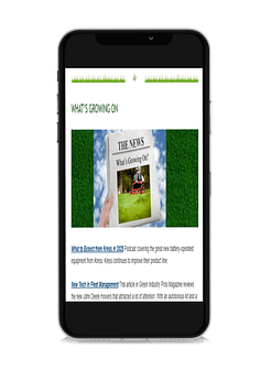A smartphone displaying a webpage titled "WHAT'S GROWING ON." It features a hand holding a newspaper with the headline "THE NEWS." Below are two article summaries about Kress's battery-operated equipment and new fleet management technology. A smartphone displaying a webpage titled "WHAT'S GROWING ON." It features a hand holding a newspaper with the headline "THE NEWS." Below are two article summaries about Kress's battery-operated equipment and new fleet management technology.