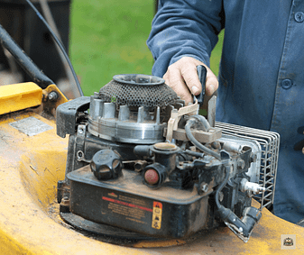 Mower Maintenance-man-with-mower Mower maintenance man working on mower