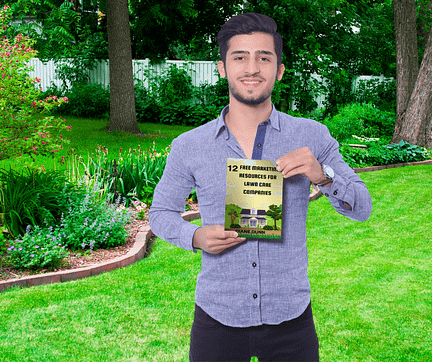 Man on lawn with free book