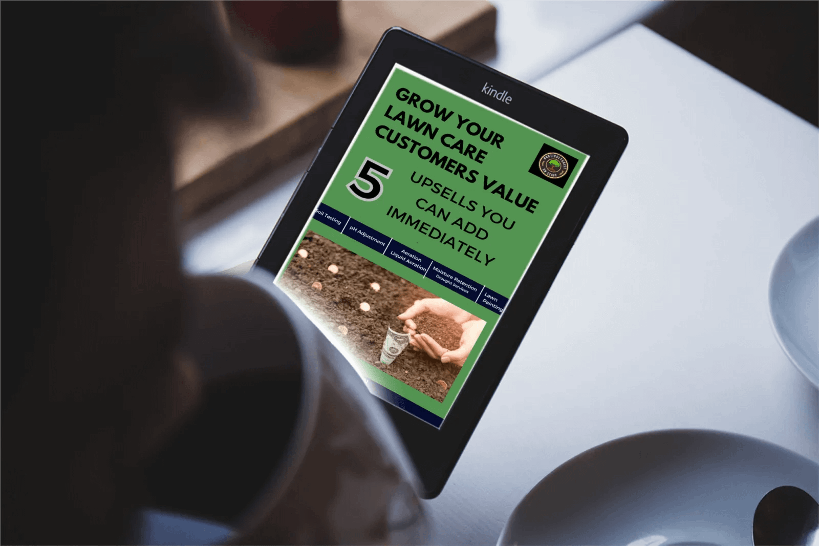 Man reading ebook on tablet - 5 Upsells you can add immediately