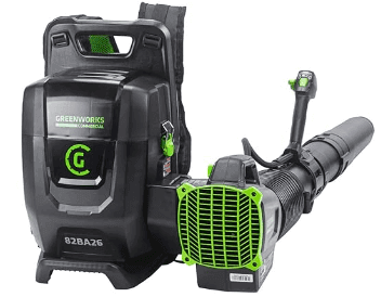 A black and green backpack leaf blower with the brand "Greenworks Commercial" displayed. The blower has a sturdy design, featuring a tube and handle attached to a large backpack unit.